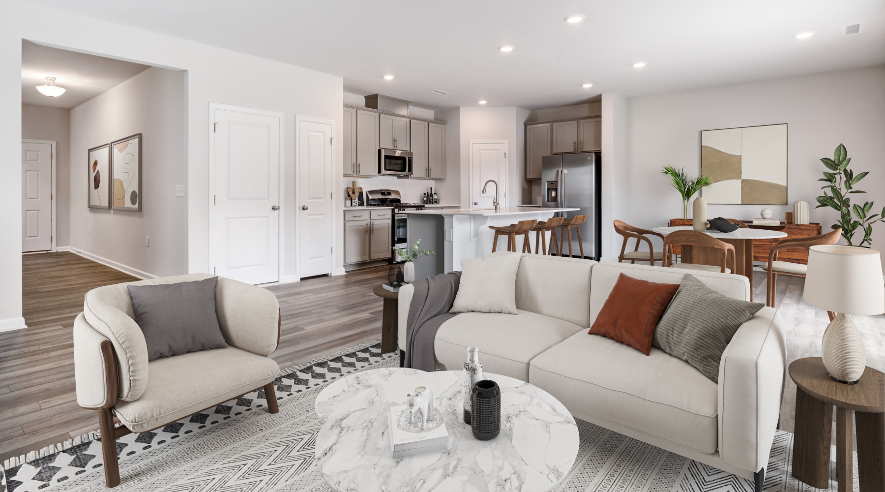 Open-concept living room and kitchen designs in homes for rent in Fuquay-Varina at SkyMor at Geneva.