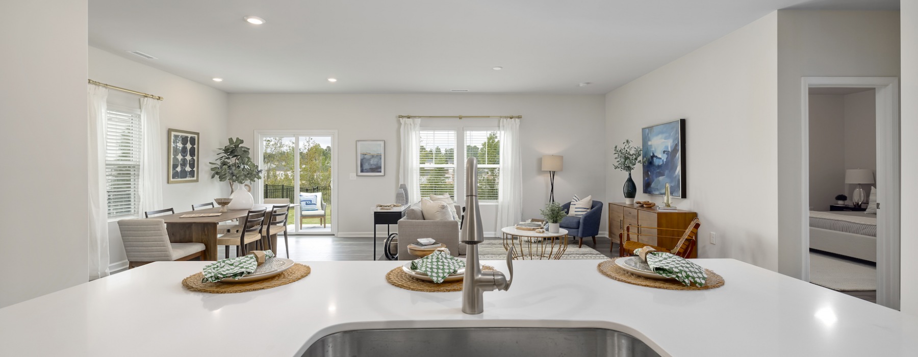 View from the kitchen island overlooking the living area at Abode at Geneva homes for rent near Wendell.