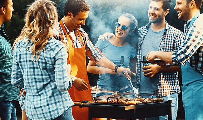 stock image of friends grilling